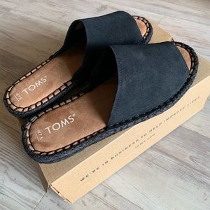 Toms size 7.5 black slides. Never worn.